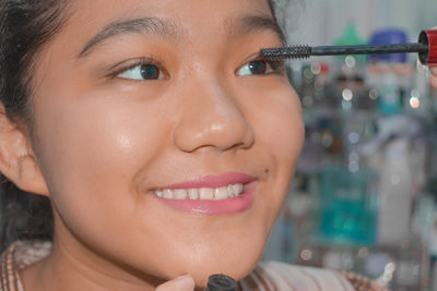 Close-up portrait of a smiling young woman