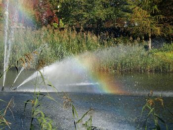 Scenic view of rainbow over water