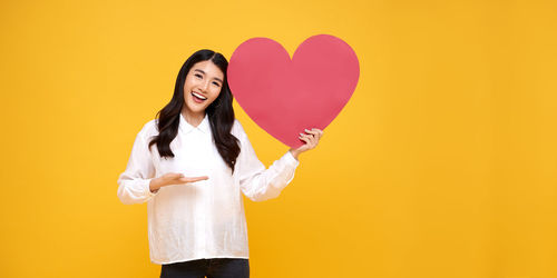 Woman holding a heart shape