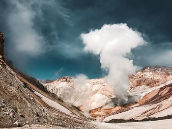 Panoramic view of volcanic landscape against cloudy sky