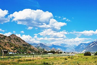 Scenic view of field and aerospace against sky