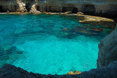 High angle view of lake amidst rock formations