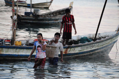 People on boat in sea