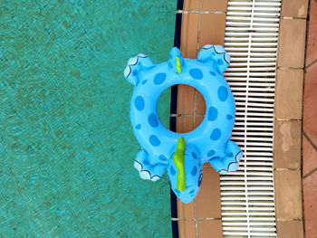 Top view of inflatable toy next to a swimming pool