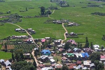 High angle view of agricultural field and houses