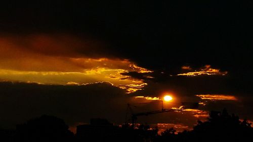 Silhouette trees against sky during sunset