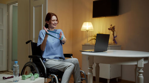 Young woman exercising at home