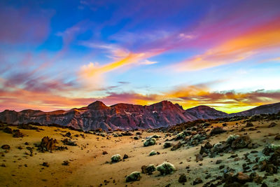 Scenic view of mountains against sky during sunset
