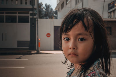 Portrait of cute girl standing outdoors