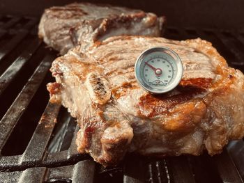 High angle view of meat on barbecue grill