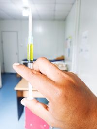 Cropped hand of scientist working in laboratory