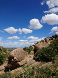 Rock formations on landscape against sky