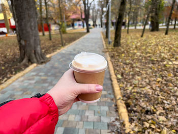 Close-up of hand holding coffee