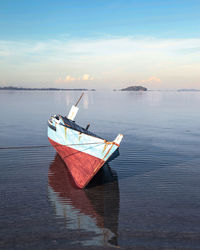 Boat in sea against sky