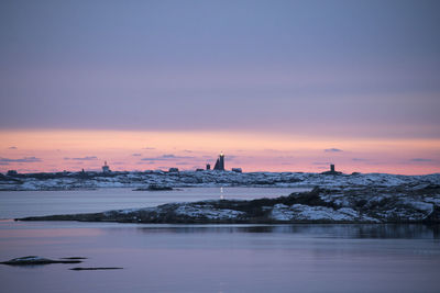 View of sea against cloudy sky during sunset