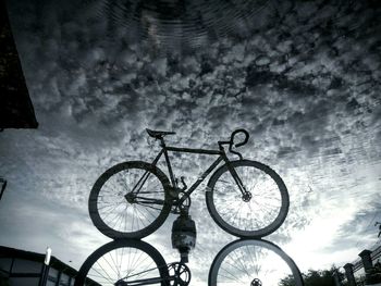 Low angle view of bicycle against sky