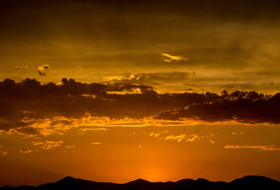 Scenic view of mountains at sunset