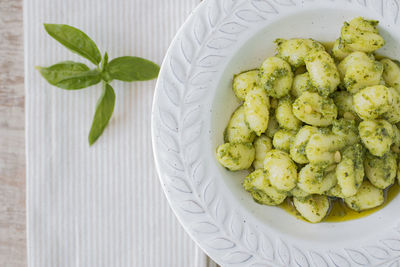 Gnocchi with pesto and basil from above.