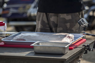 Mid section of a man preparing food