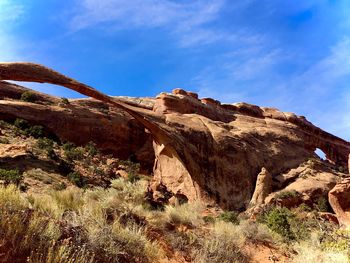 Rock formations on landscape against sky