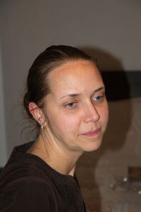 Portrait of young woman looking away at home