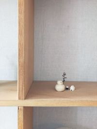 Electric lamp on table against wall at home
