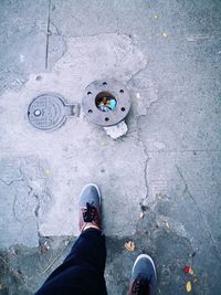 Low section of man standing on footpath