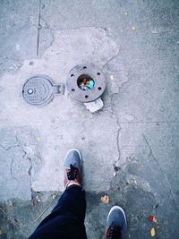 Low section of man standing on footpath