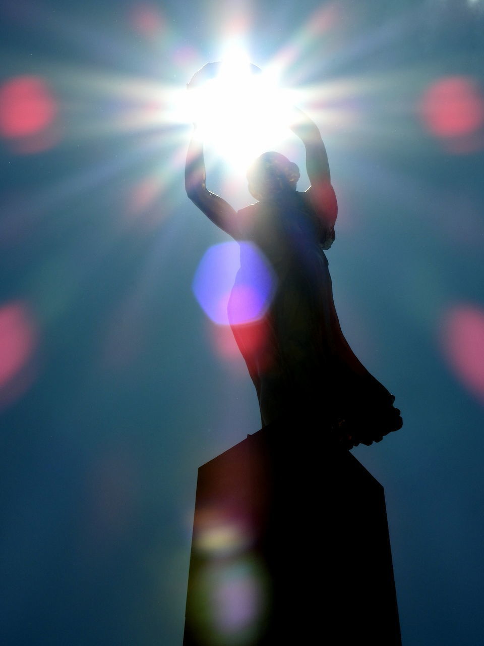 LOW ANGLE VIEW OF SILHOUETTE HAND AGAINST SKY