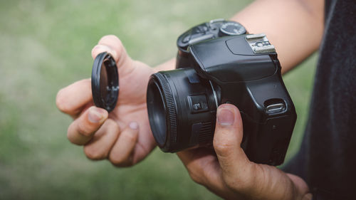 Close-up of hand holding camera