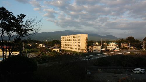 Buildings against cloudy sky