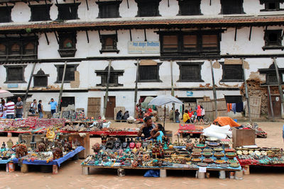 Group of people at market stall