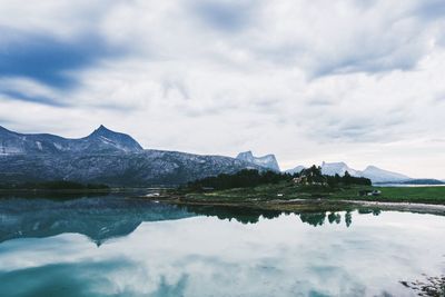 Scenic view of lake and mountains against sky