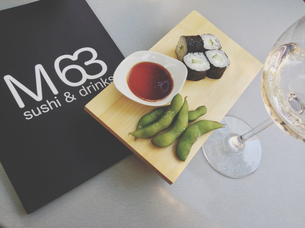 indoors, table, food and drink, still life, plate, freshness, high angle view, drink, food, coffee cup, refreshment, communication, spoon, no people, text, directly above, close-up, healthy eating, fork, cup