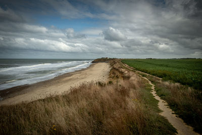 Scenic view of beach against sky