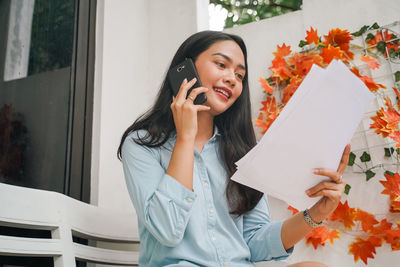 Young woman using mobile phone