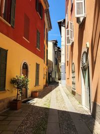 Alley amidst buildings  in european old town. cernobbio, italy