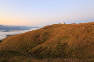 Scenic view of landscape against sky during sunset