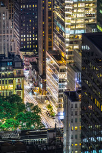 High angle view of illuminated buildings in city at night