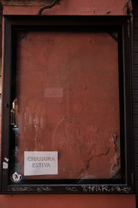 Text on window of old building