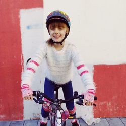 Portrait of smiling girl riding bicycle