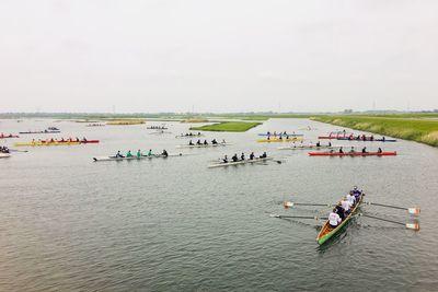 High angle view of people on boats in sea