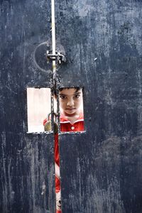 Close-up portrait of young woman hanging outdoors