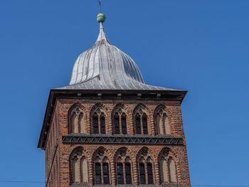 Low angle view of building against blue sky