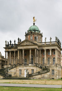 Facade of historic building against sky