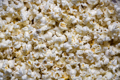 A scattering of cooked popcorn. view from the top. background