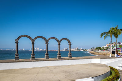 Scenic view of sea against clear blue sky