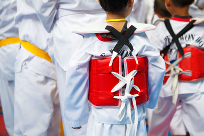 People standing in front of flag