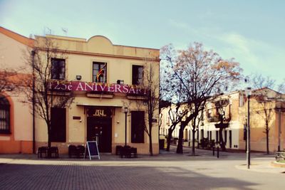 Exterior of building by street against sky