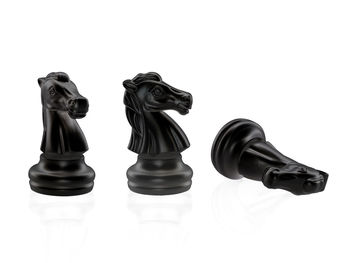 Close-up of chess pieces against white background